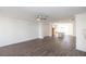 Living room with hardwood floors, modern appliances, and an adjacent kitchen space at 1132 Larkin Dr # 34, Buford, GA 30518
