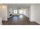 Spacious open living room with hardwood floors, natural light, and modern finishes at 1132 Larkin Dr # 34, Buford, GA 30518
