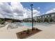Resort-style pool surrounded by lounge chairs and modern apartment buildings at 1132 Larkin Dr # 34, Buford, GA 30518