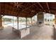 Spacious pool pavilion with a stone fireplace, ceiling fans, and a countertop bar for entertaining guests at 1132 Larkin Dr # 34, Buford, GA 30518