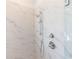 Detail of the shower showcasing the marble tile surround and modern fixtures at 1132 Larkin Dr # 34, Buford, GA 30518
