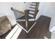 Modern staircase with dark wood treads and black metal balusters leading to the upper level at 1132 Larkin Dr # 34, Buford, GA 30518