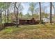 The backyard of this property includes a deck and a grassy area at 3100 Meadow Dr, Marietta, GA 30062