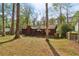 The backyard of this property features a deck and shady trees at 3100 Meadow Dr, Marietta, GA 30062