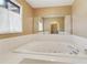 Large soaking tub with jets and a view into the rest of the bathroom at 3100 Meadow Dr, Marietta, GA 30062