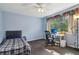 Cozy bedroom with a desk, a bed, and natural light at 3100 Meadow Dr, Marietta, GA 30062