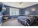 Cozy bedroom features a ceiling fan, large window, and a mounted TV for relaxing evenings at 3100 Meadow Dr, Marietta, GA 30062