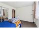 Bedroom featuring carpet, window, and a sliding closet door for a clean, organized look at 3100 Meadow Dr, Marietta, GA 30062