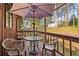 Relaxing outdoor space with a covered deck featuring seating and a view of the wooded surroundings at 3100 Meadow Dr, Marietta, GA 30062