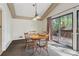Cozy dining area with wood furniture and sliding glass doors to the outdoor deck at 3100 Meadow Dr, Marietta, GA 30062
