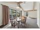 Bright dining space with deck access, stylish lighting, and comfortable seating at 3100 Meadow Dr, Marietta, GA 30062