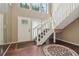 Light-filled foyer with high ceilings, wood floors, and a modern staircase at 3100 Meadow Dr, Marietta, GA 30062