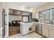 Clean kitchen with white tile, stainless appliances, and an open layout at 3100 Meadow Dr, Marietta, GA 30062