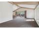 Spacious living area with beamed ceilings and sliding glass doors to the deck at 3100 Meadow Dr, Marietta, GA 30062