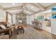 Inviting living room featuring a stone fireplace, wood floors, and exposed beam ceiling at 3100 Meadow Dr, Marietta, GA 30062
