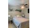 Relaxing bedroom with ceiling fan, calming artwork, and coordinated bedding at 6308 Boyett Drive Dr, Norcross, GA 30093
