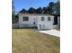 Two-story home featuring a well-manicured front yard and a driveway at 6308 Boyett Drive Dr, Norcross, GA 30093