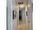 Neutral hallway with doors leading to other rooms and framed artwork hanging on walls at 6308 Boyett Drive Dr, Norcross, GA 30093