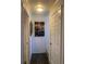 Hallway with wood flooring, art, and white doors at 6308 Boyett Drive Dr, Norcross, GA 30093
