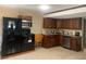 Kitchen featuring stainless steel appliances, granite counters, and wooden cabinets at 6308 Boyett Drive Dr, Norcross, GA 30093