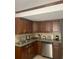Kitchen showcasing granite counters, stainless steel appliances, and wooden cabinets at 6308 Boyett Drive Dr, Norcross, GA 30093