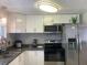 Well-lit kitchen boasts stainless steel appliances, modern cabinetry, and sleek countertops at 6308 Boyett Drive Dr, Norcross, GA 30093