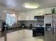 Bright kitchen features modern appliances, granite countertops, and ample cabinet storage at 6308 Boyett Drive Dr, Norcross, GA 30093