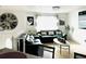 Bright living room with leather sofas, decorative pillows, and eye-catching wall decor, creating a cozy and inviting space at 6308 Boyett Drive Dr, Norcross, GA 30093