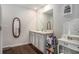 Bright bathroom with double sink vanity, large mirror and white cabinets at 1310 Roger Trace, Lithonia, GA 30058