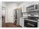 Modern kitchen with stainless steel appliances, granite countertops and updated cabinets at 1310 Roger Trace, Lithonia, GA 30058
