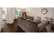 Comfortable living room with hardwood floors, large windows and elegant furniture at 1310 Roger Trace, Lithonia, GA 30058
