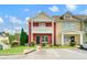 Charming townhome exterior featuring a cozy front porch and well-maintained landscaping at 1780 Brookside Lay Cir, Norcross, GA 30093