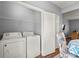 Convenient laundry area equipped with a washer and dryer in the interior of the home at 1780 Brookside Lay Cir, Norcross, GA 30093