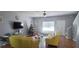 Open-concept living room with contemporary furniture and hardwood floors and adjacent staircase at 1780 Brookside Lay Cir, Norcross, GA 30093