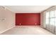 A large bedroom with neutral walls, a striking accent wall, and ample natural light at 3403 Ashwood Ln, Atlanta, GA 30341