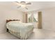 Bedroom features a ceiling fan, carpeted floors and windows with curtains at 3403 Ashwood Ln, Atlanta, GA 30341