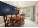 Cozy dining room with wooden table set, chandelier lighting, and a sliding glass door to the patio at 3403 Ashwood Ln, Atlanta, GA 30341