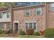 A brick townhome with trimmed bushes and a tidy front lawn at 3403 Ashwood Ln, Atlanta, GA 30341