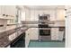 Modern kitchen featuring stainless steel appliances, granite countertops, and bright white cabinets at 3403 Ashwood Ln, Atlanta, GA 30341