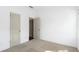 Bright, carpeted bedroom featuring neutral colors and two closet doors offering ample storage space at 3706 Clovis Nw Ct, Atlanta, GA 30331