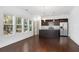 Open concept kitchen with dark cabinets, granite island and stainless steel appliances at 3706 Clovis Nw Ct, Atlanta, GA 30331