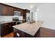 Modern kitchen with stainless steel appliances, dark cabinets, and granite countertops at 3706 Clovis Nw Ct, Atlanta, GA 30331
