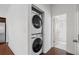 Convenient laundry area with stacked washer and dryer, plus a bathroom with walk-in shower at 3706 Clovis Nw Ct, Atlanta, GA 30331