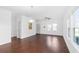 Spacious living room with hardwood floors, ceiling fan, and ample natural light from large windows at 3706 Clovis Nw Ct, Atlanta, GA 30331