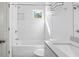Bathroom with tub/shower combo with modern fixtures, white subway tile, and recessed storage at 3706 Clovis Nw Ct, Atlanta, GA 30331