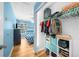 Bedroom with blue walls, wood-look floors, and closet with ample storage space at 1725 Silverchase Sw Dr, Marietta, GA 30008