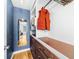 Walk-in closet with custom shelving, drawers, a mirror and wood-look floors at 1725 Silverchase Sw Dr, Marietta, GA 30008