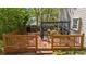 Well-designed wooden deck with a stylish railing, seating area, and outdoor cooking space at 1725 Silverchase Sw Dr, Marietta, GA 30008