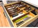 Kitchen drawer features custom wood dividers for organizing cutlery and utensils at 1725 Silverchase Sw Dr, Marietta, GA 30008