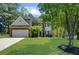 Charming two-story home with a brick facade, manicured lawn, and mature trees at 1725 Silverchase Sw Dr, Marietta, GA 30008